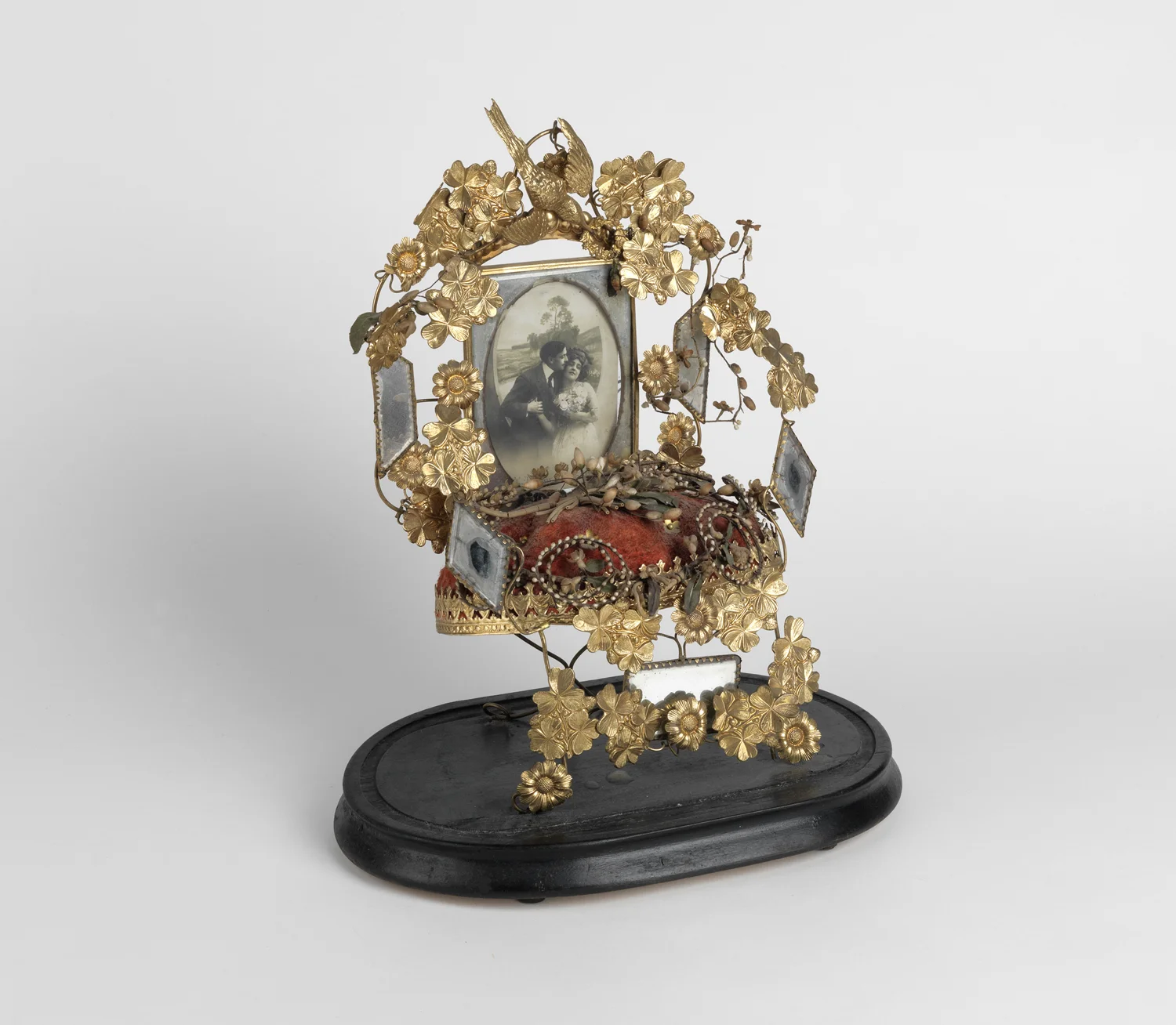 Victorian gilt wedding altar inset with a photograph of an amorous couple. Circa 1900
