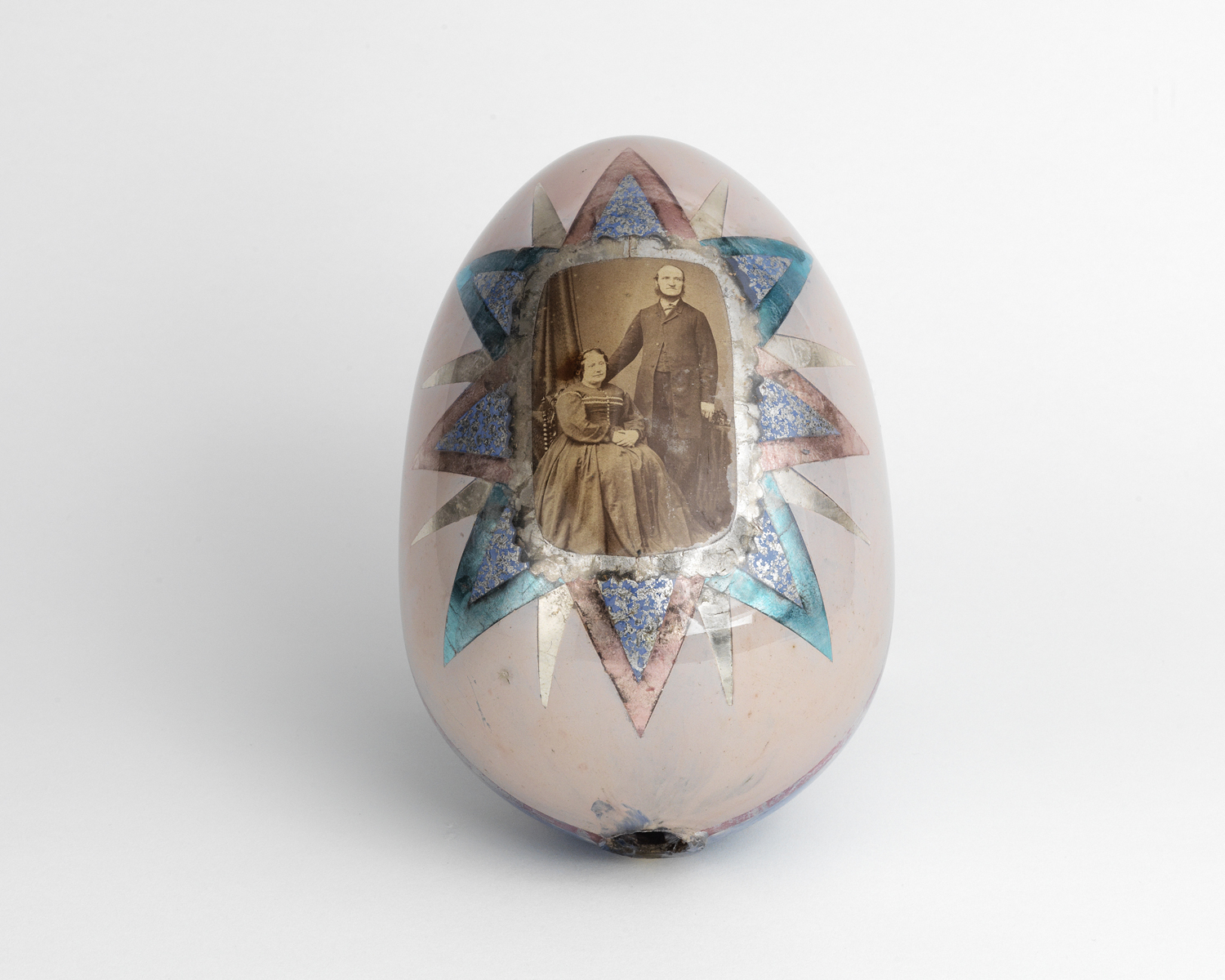    Hand painted glass egg with original photograph of a couple. 1880s   