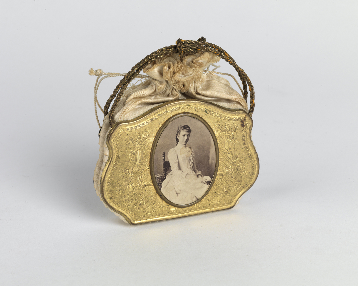    Venetian-style child's purse with an albumen portrait. Circa 1861   