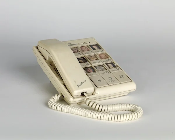 Touch phone with images of friends and family members. Circa 1970
