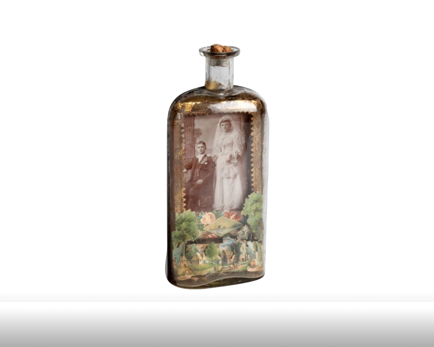    Whiskey bottle with portrait of newlyweds set against a die cut pastoral background. 1880s   