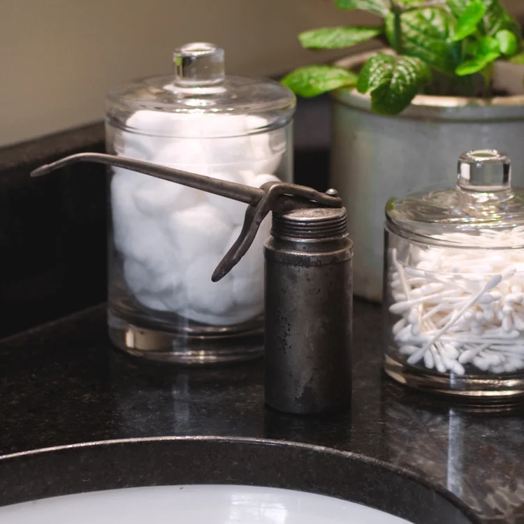 Not your typical use for this aging oil can, but it's the perfect soap dispenser in my rustic bathroom. It's inspired me to repurpose other rusty tools for the bath.