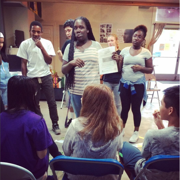 Youth participating in a role playing activity on organizing.