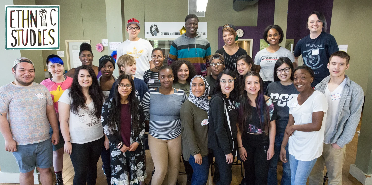 Youth stand in a group, an Ethnic Studies logo in the upper left corner.