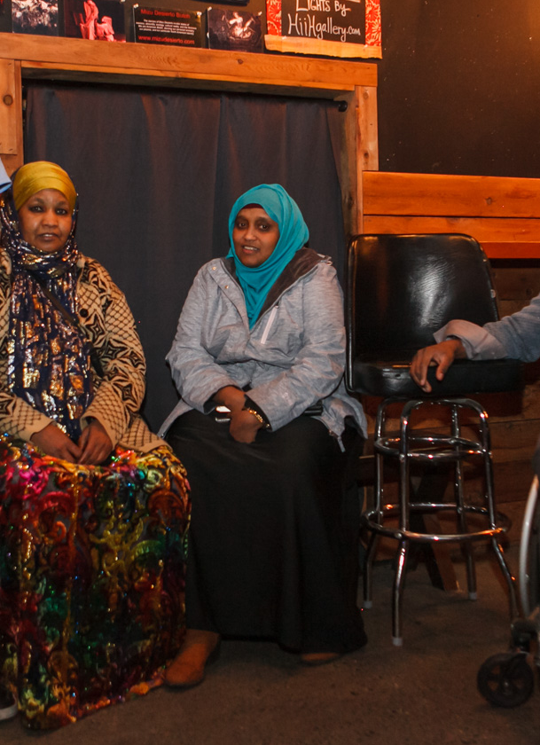 Saara sits with other members of her African immigrant/refugee community.