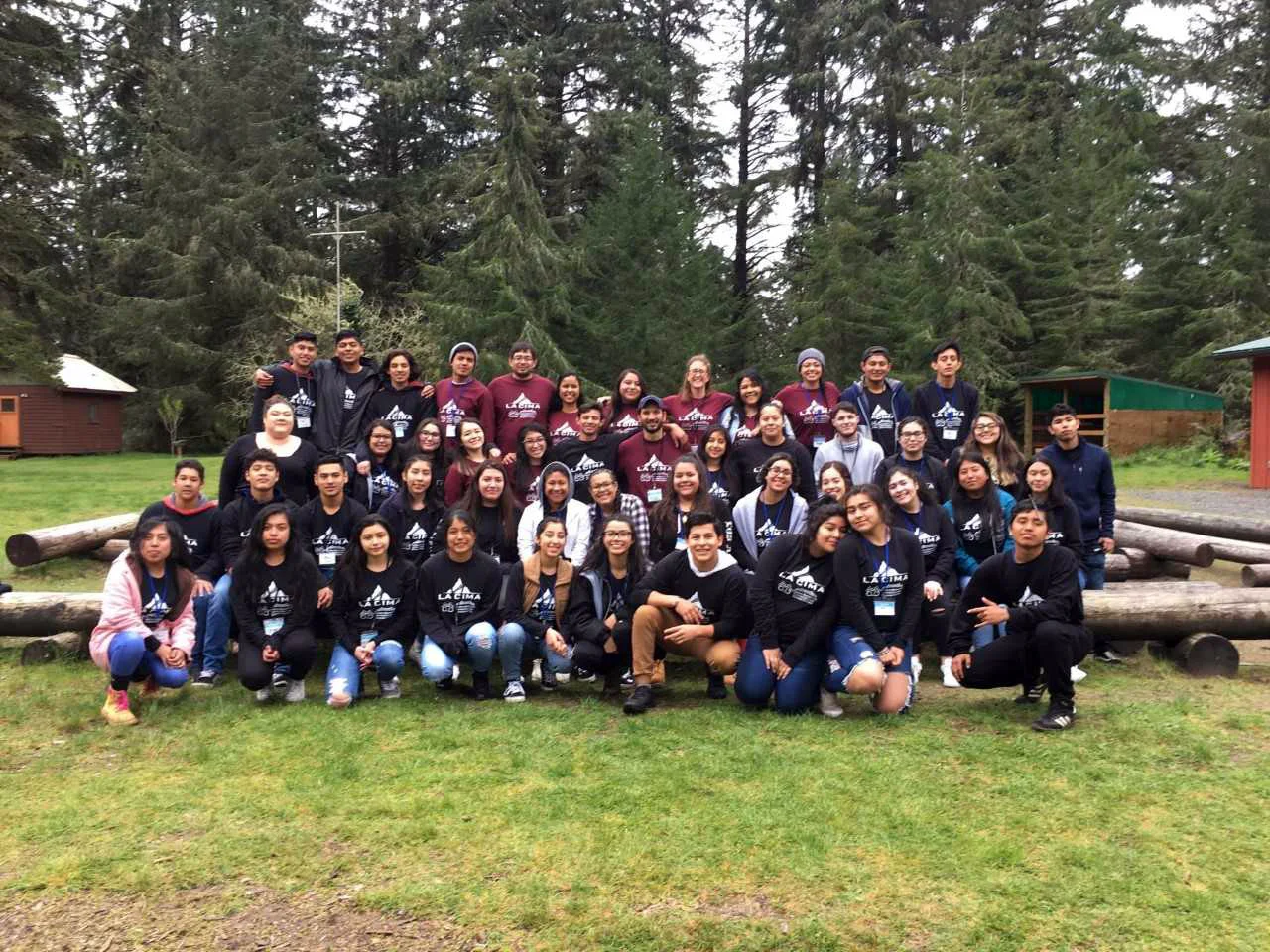 Participants and staff in the second La Cima Lower Columbia camp in 2018 pose together in rows. There are 48 people total.
