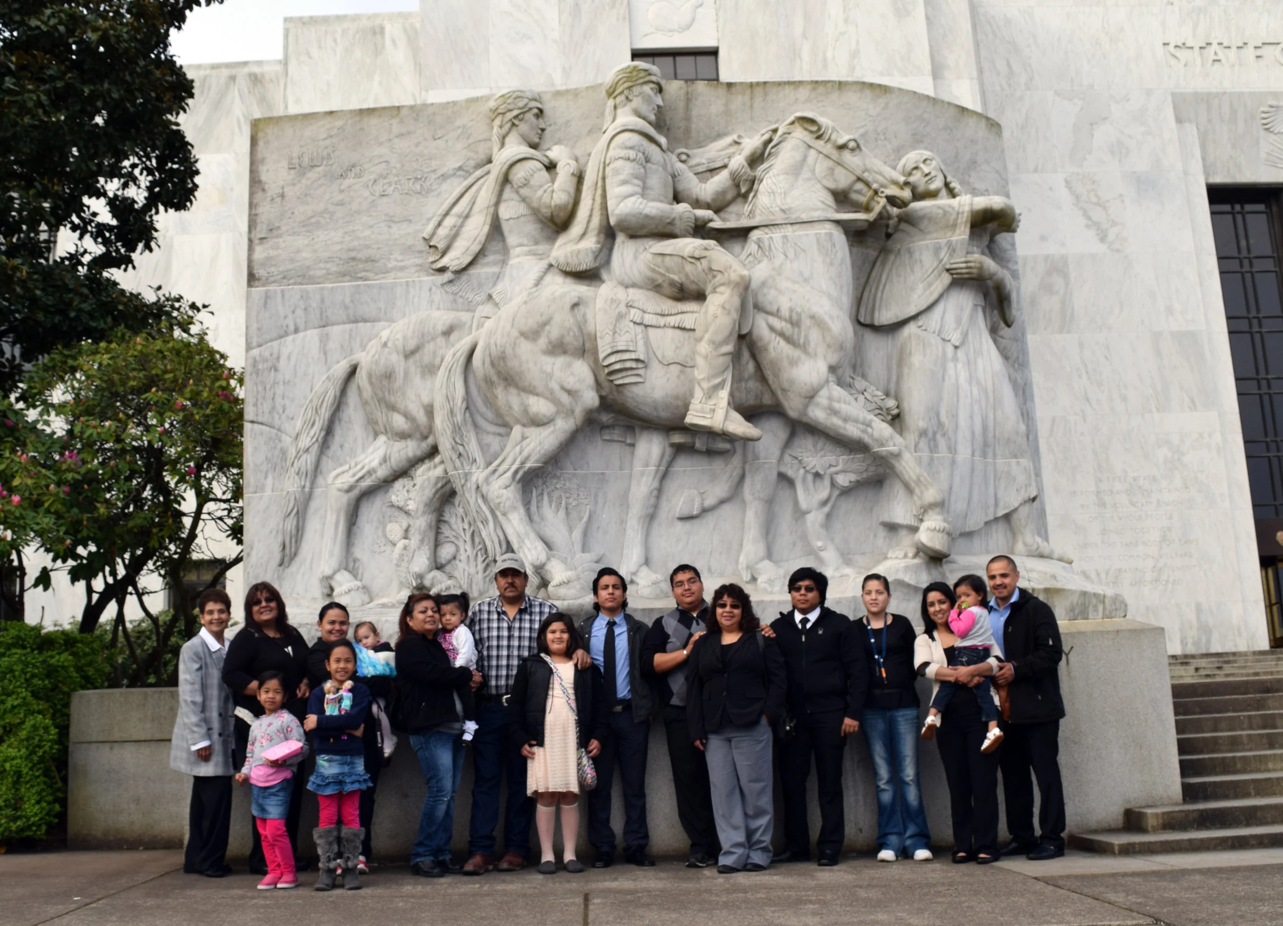 Members of the Eastern Oregon Latino Alliance for Children and Families pose in front of the Oregon State Capitol building.