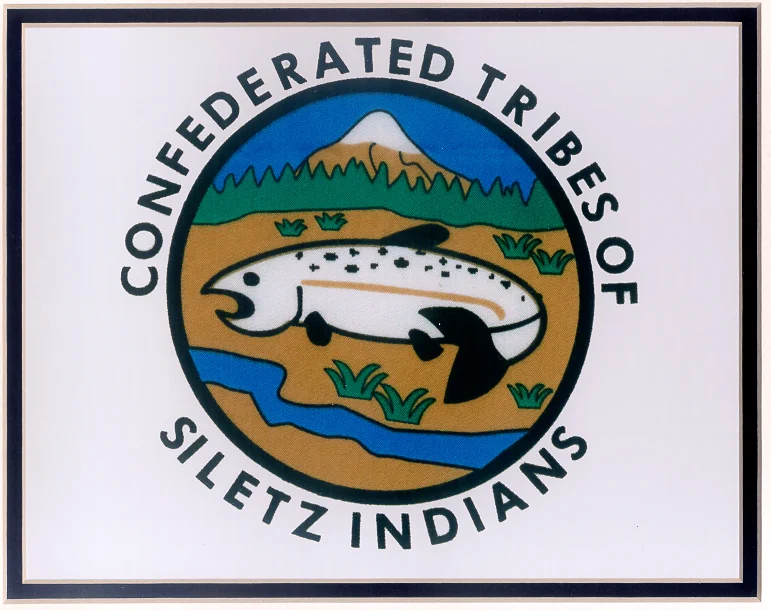 The Confederated Tribes of Siletz logo depicts a fish with a river below it and mountain above.