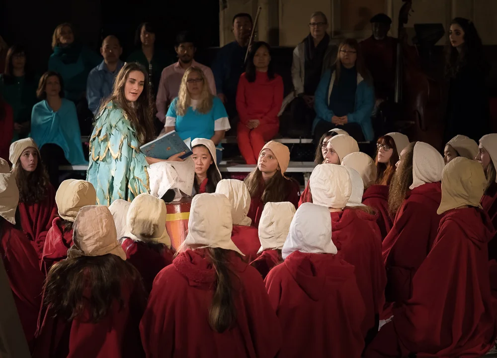 Vireo (Rowen Sabala), awakened from her drug-induced sleep, sings the Dragon Aria to the "afflicted girls" (San Francisco Girls Chorus).