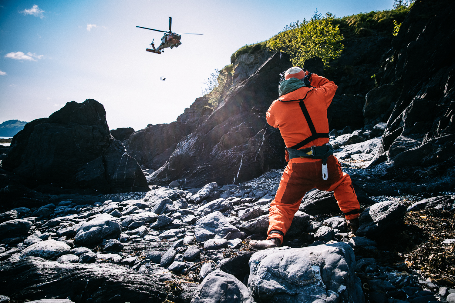Justin Bastien shooting high angle cliff rescue operations in Kodiak, Alaska.