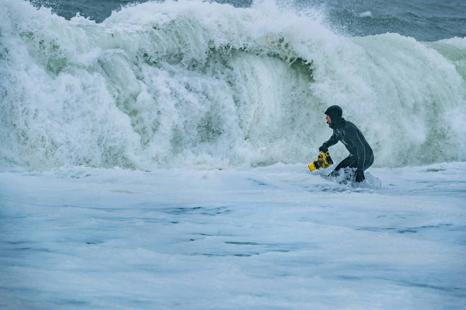 Justin heads in after a rough day in cold Alaskan waters photographing the Rescue Swimmers in high surf ops.