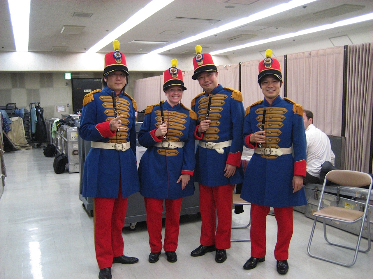 Stephanie poses with the piccolo section in Japan, 2011. These smiling piccoloists add marching in lockstep to the list of circumstantial variables affecting intonation. 