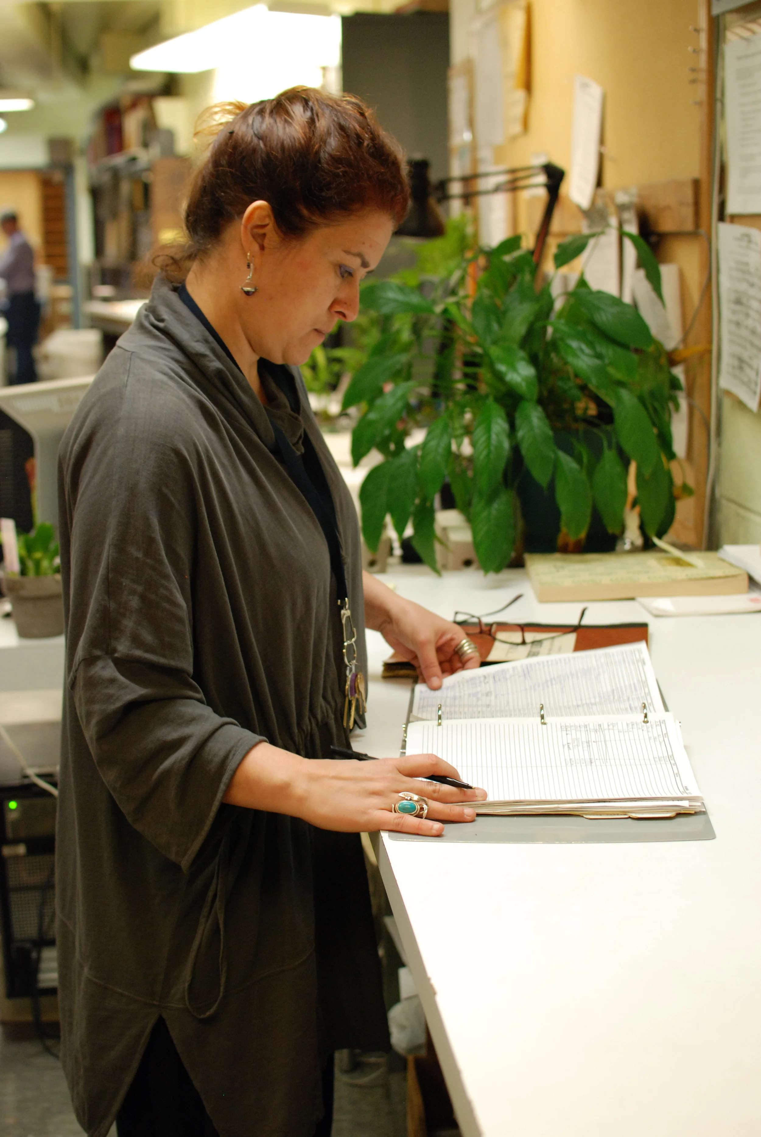 Àngels Martinez checks out a part for a musician during a rehearsal break.