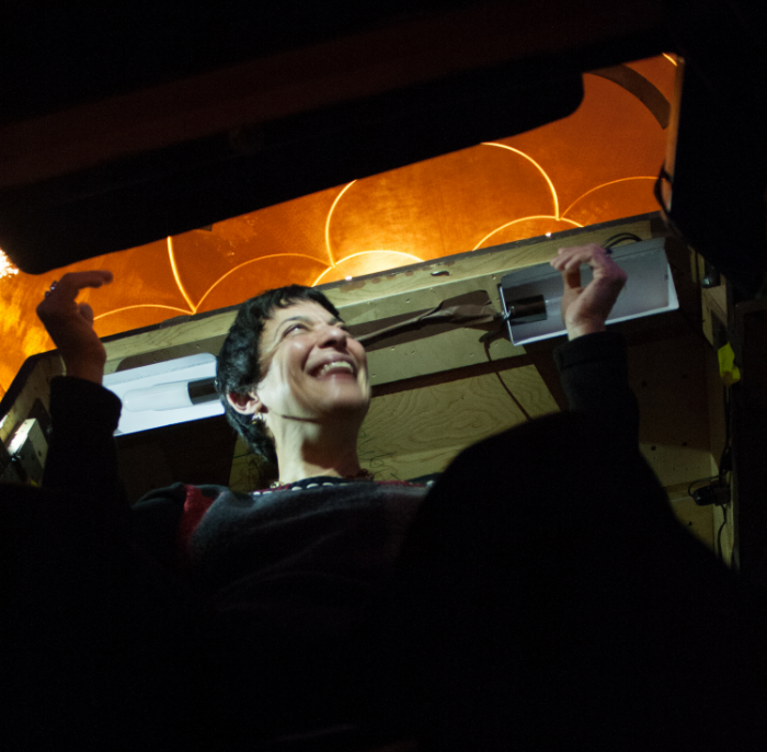 a view of Donna Racik in the prompter's box; photo credit, Stephanie Mortimore