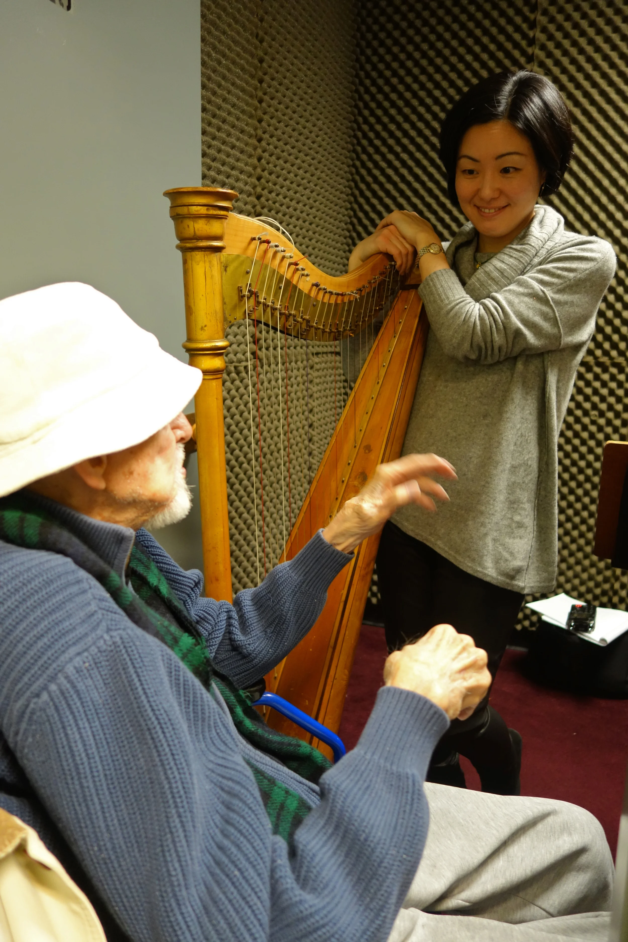 Retired Principal Harpist Reinhardt Elster and current Met harpist Mariko Anraku.