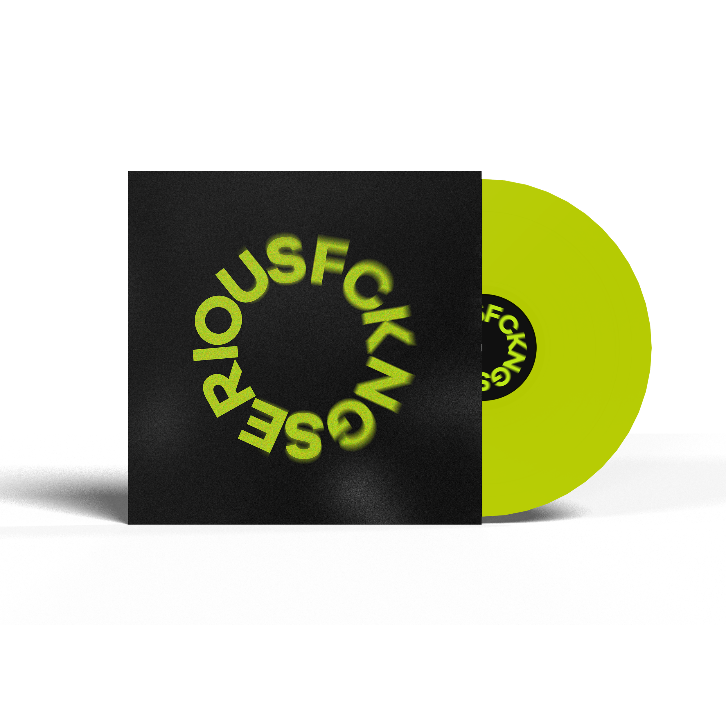 Green vinyl record and black album cover with circular text "FCK N**" in yellow. The record is partially pulled out from the cover, showcasing part of the record and label.