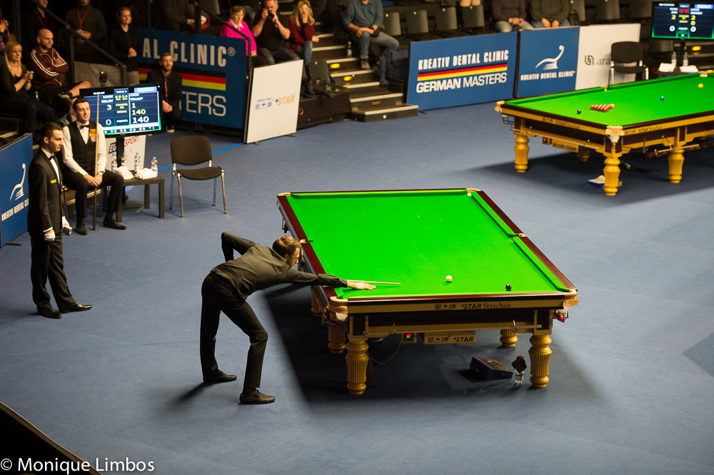 Judd Trump knocks in the final black of his 147