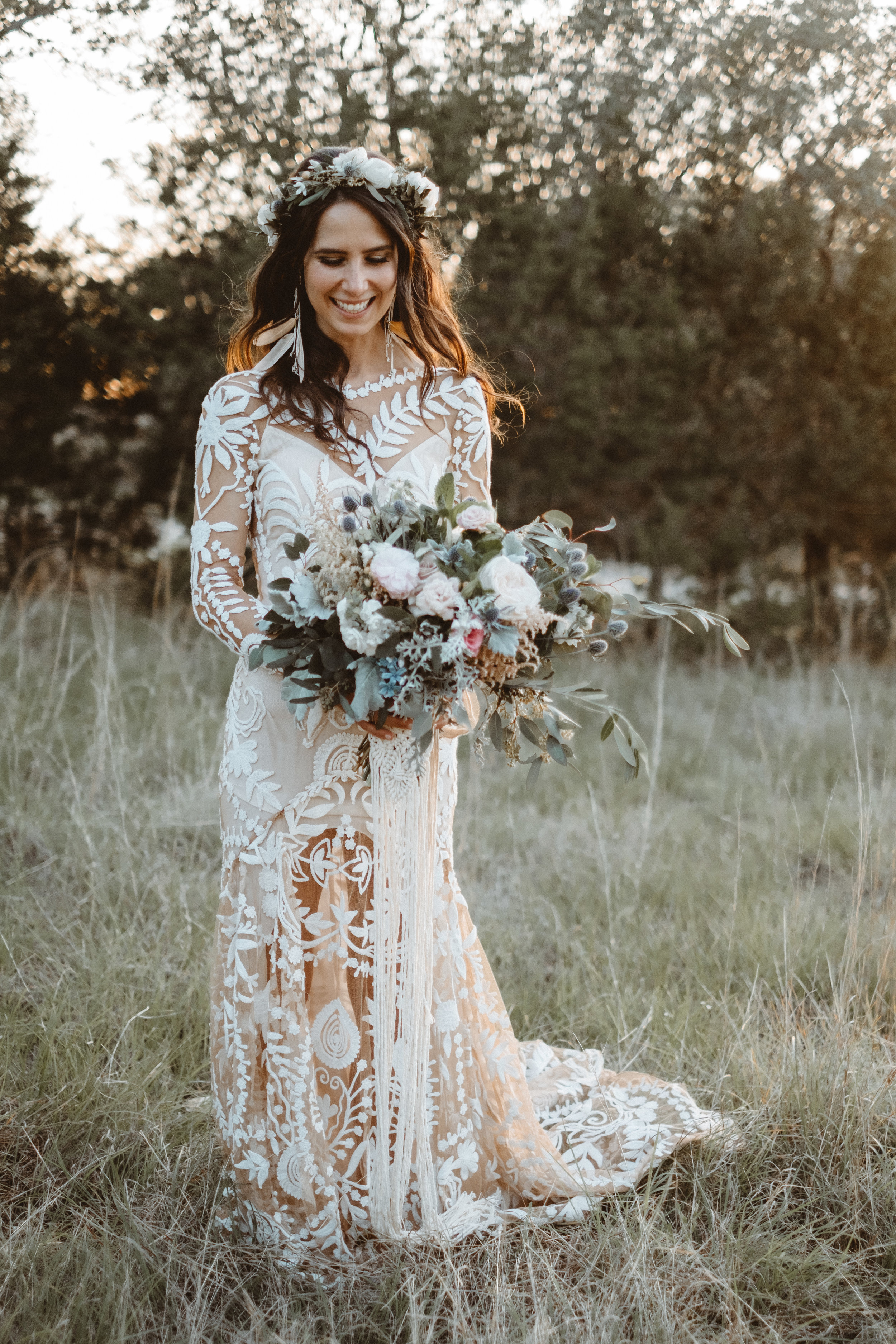  Bohemian style, wildflower inspired bridal and bridesmaid bouquets with white peonies, protea, eucalyptus, anemone, ranunculus at Vista West Ranch. Petal Pushers floral event design studio located in Dripping Springs, Texas. 