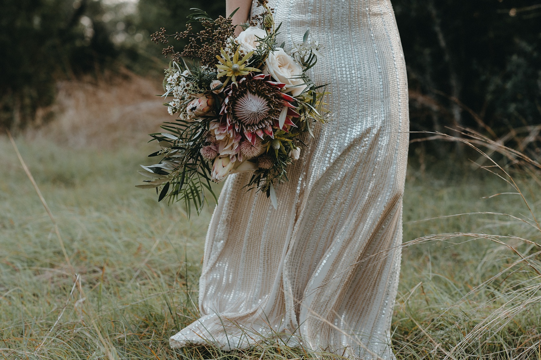  Bohemian style, wildflower inspired bridal and bridesmaid bouquets with eucalyptus, protea, peonies at Vista West Ranch. Petal Pushers floral event design studio located in Dripping Springs, Texas. 