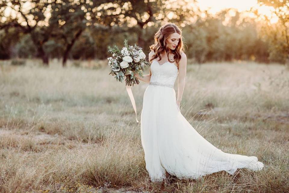  Bohemian style, wildflower inspired bridal and bridesmaid bouquets with white garden roses, eucalyptus, anemone, ranunculus at The Creek Haus. Petal Pushers floral event design studio located in Dripping Springs, Texas. 