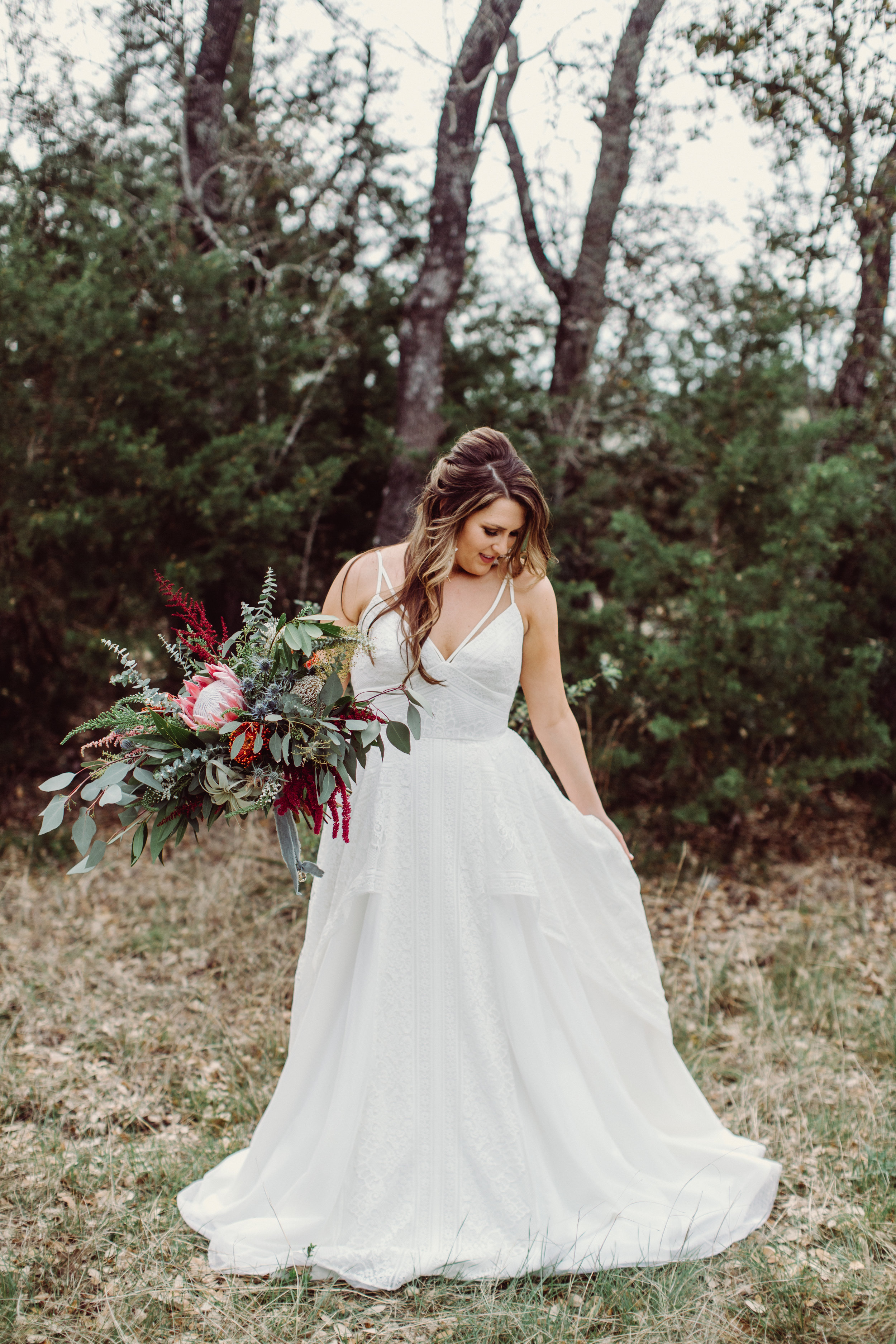  Boho wedding bride bouquets with eucalyptus, protea, thistle, astilbe Petal Pushers floral event design studio located in Dripping Springs, Texas. 