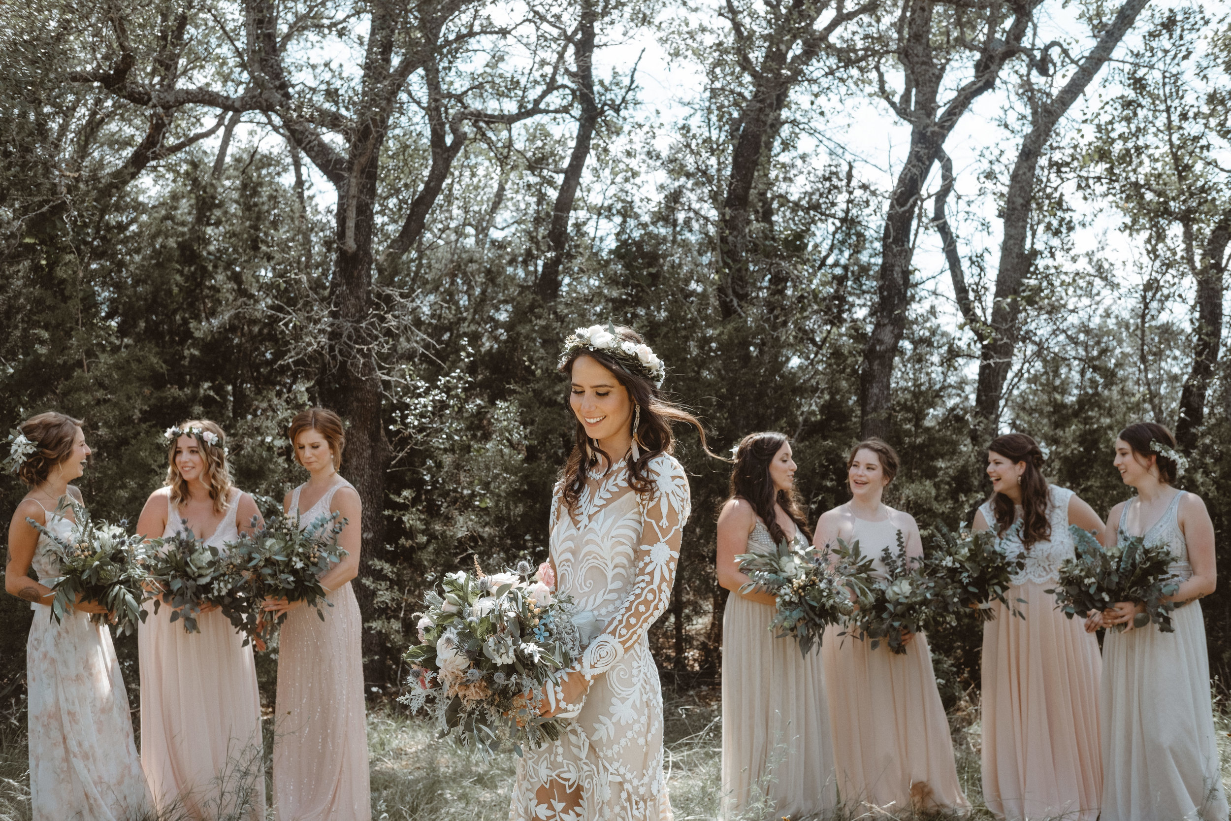  Bohemian style, wildflower inspired bridal and bridesmaid bouquets with white peonies, protea, eucalyptus, anemone, ranunculus at Vista West Ranch. Petal Pushers floral event design studio located in Dripping Springs, Texas. 