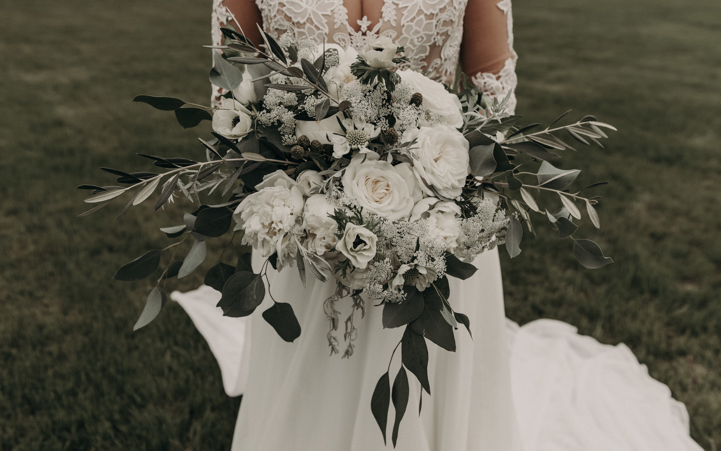  Bohemian style, wildflower inspired bridal and bridesmaid bouquets with white garden roses, eucalyptus, anemone, ranunculus at The Creek Haus. Petal Pushers floral event design studio located in Dripping Springs, Texas. 