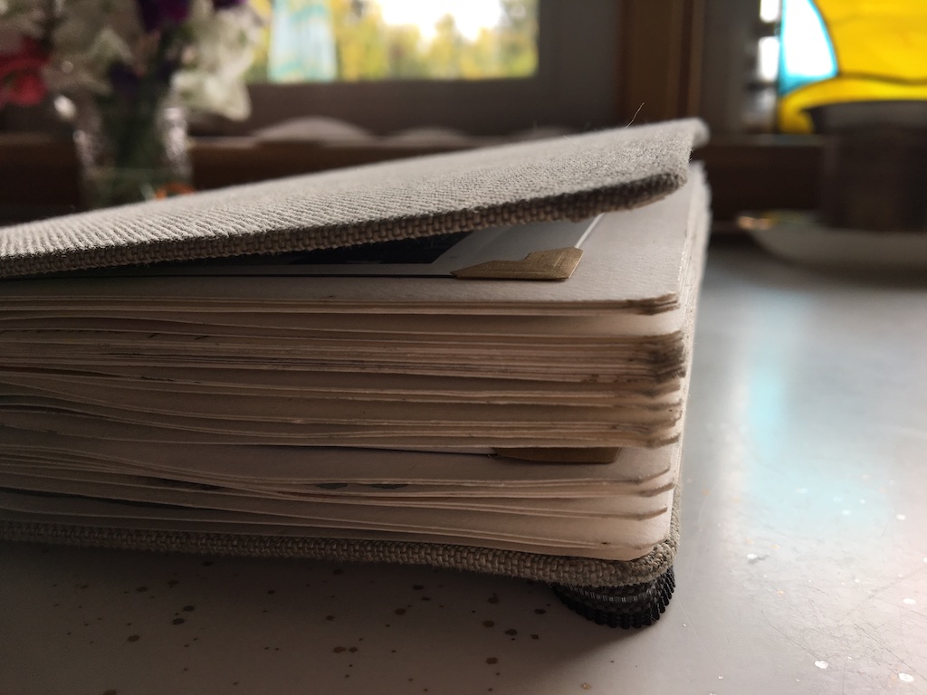 i love how fat a sketchbook gets once its filled with. this is mostly due to the photos i intersperse with the sketches and the small collection of memorabilia and photos that i didn’t stick to a page but still want to keep with the sketchbook that are tucked into the handy pocket on the inside back cover.