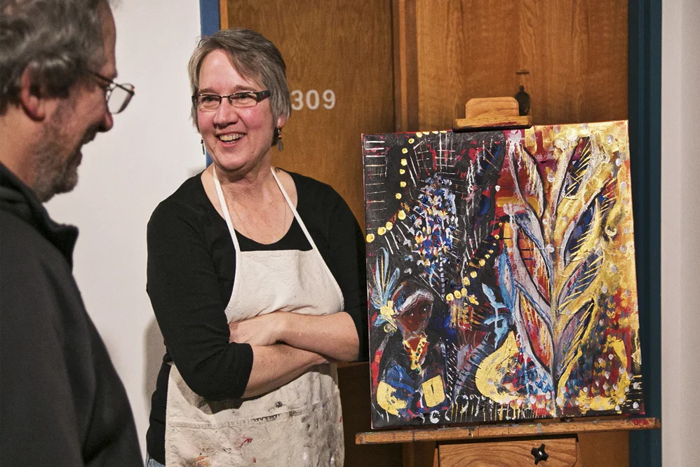Jamie Kalvestran with the finished painting after a 2hr live-painting session. Photo Credit: Patrick Clancy