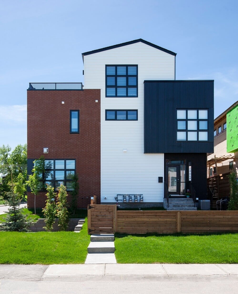 Sometimes our favourite facade isn't the front. Our Richmond 4 project is a four-unit rowhouse building a short walk from Calgary&rsquo;s Marda Loop district. The front facade evokes a turn-of-the-century warehouse, which is great, but this north fac