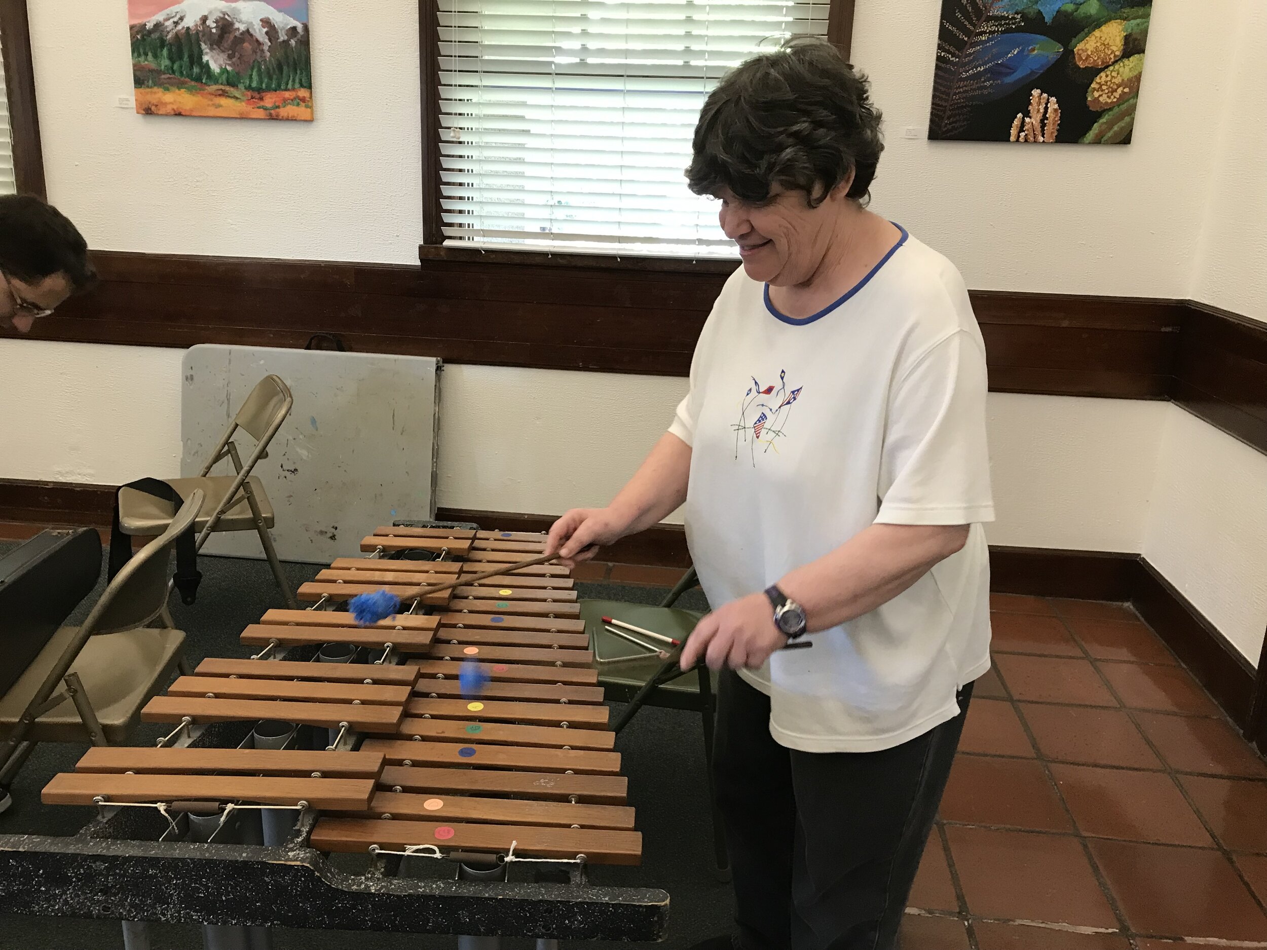  A participant playing a large xylophone in class.  