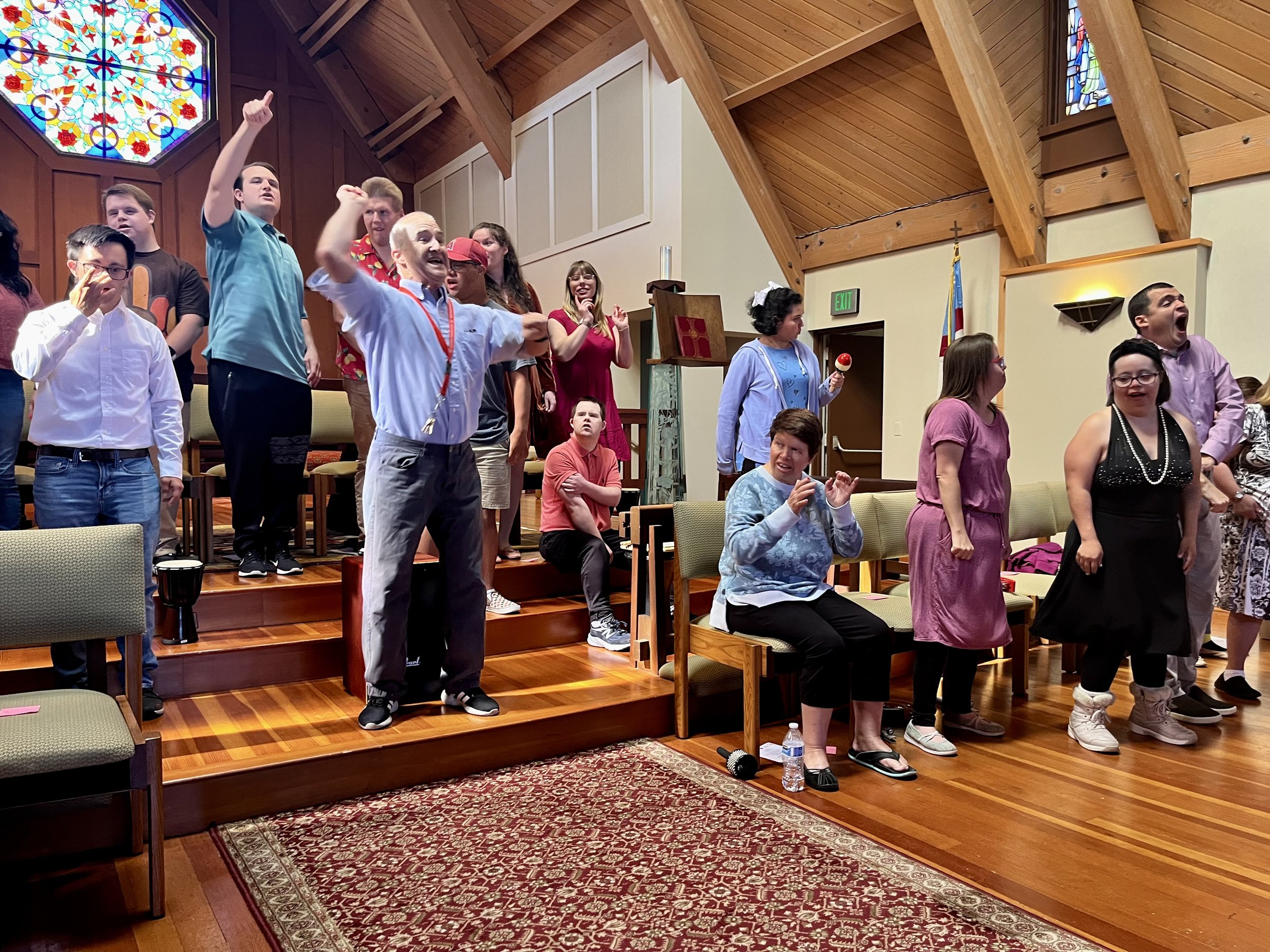  Laguna Beach participants singing, dancing, and performing at their 2023 Fall Recital and Art Boutique, in the St. Mary’s sanctuary hall. 