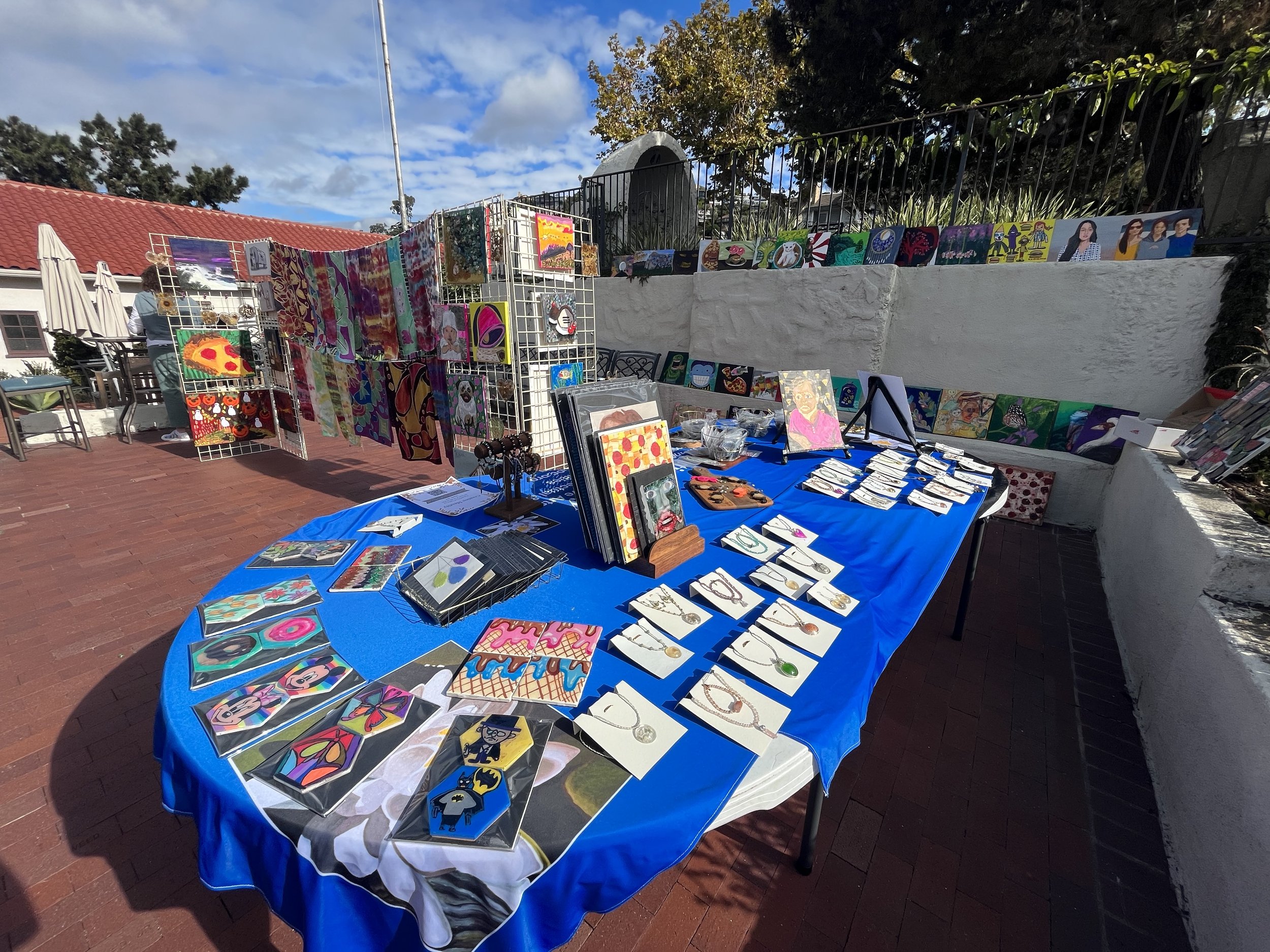  Boutique at the 2023 Laguna Beach Fall Recital and Art Exhibition with numerous paintings, coasters, magnets, jewelry, and more made by the Laguna Beach participants. 