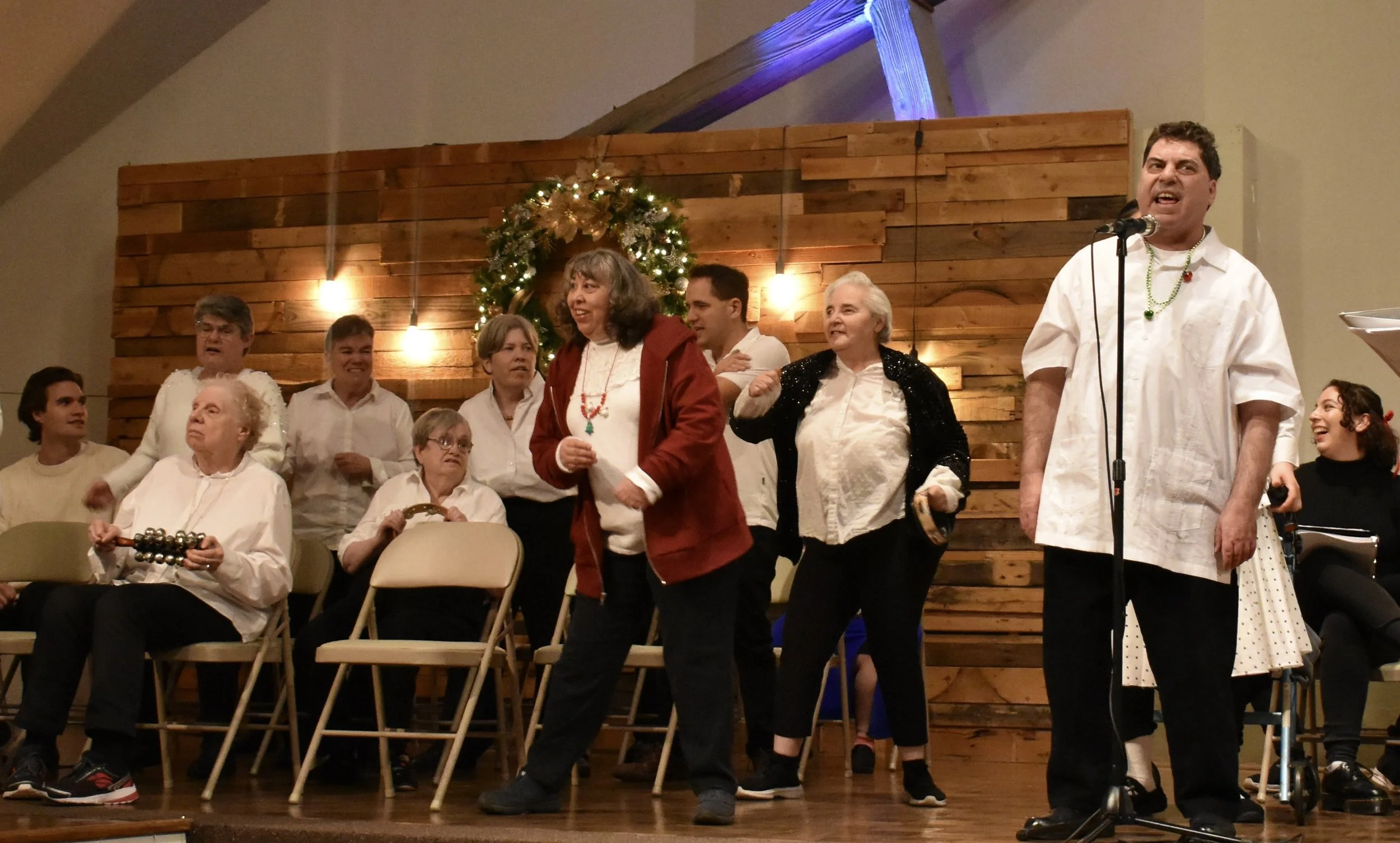  Creative Identity Anaheim participants singing, dancing, and playing instruments for their 27th Annual Winter Concert to an audience of attendees. 