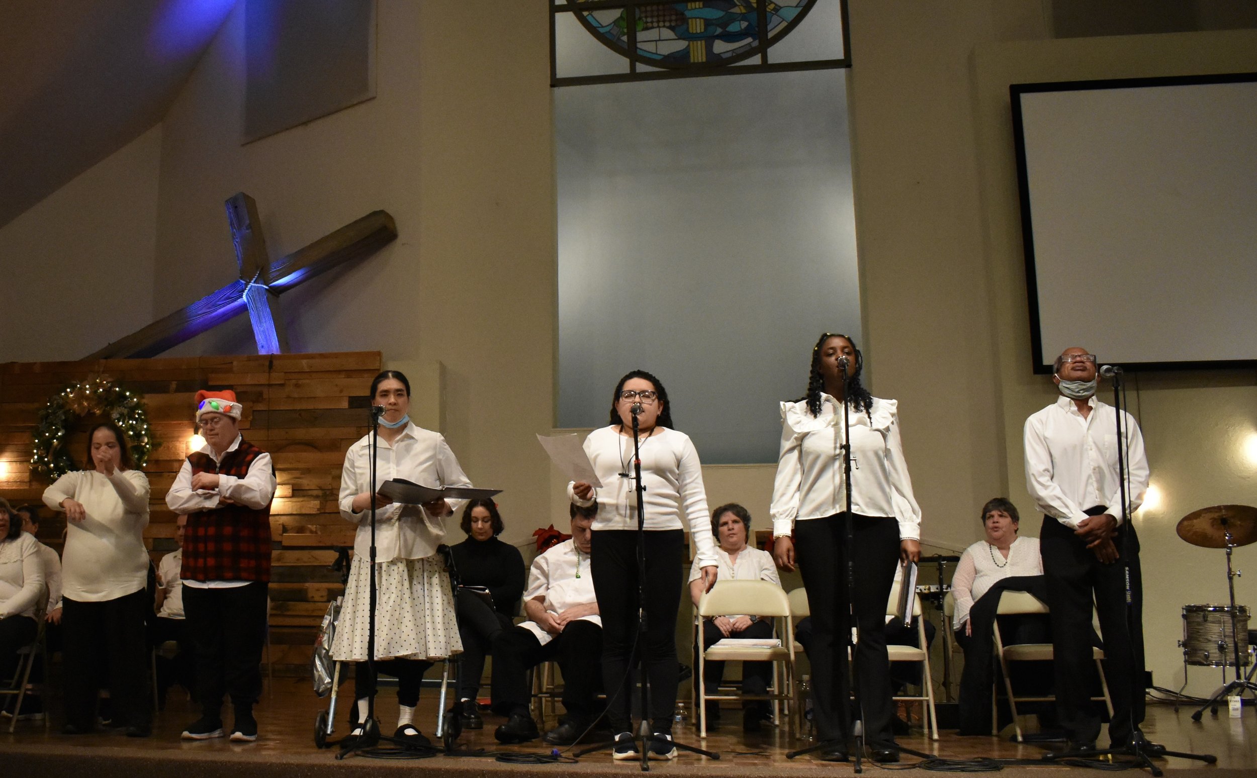  Creative Identity Anaheim participants singing, dancing, and playing instruments for their 27th Annual Winter Concert to an audience of attendees. 