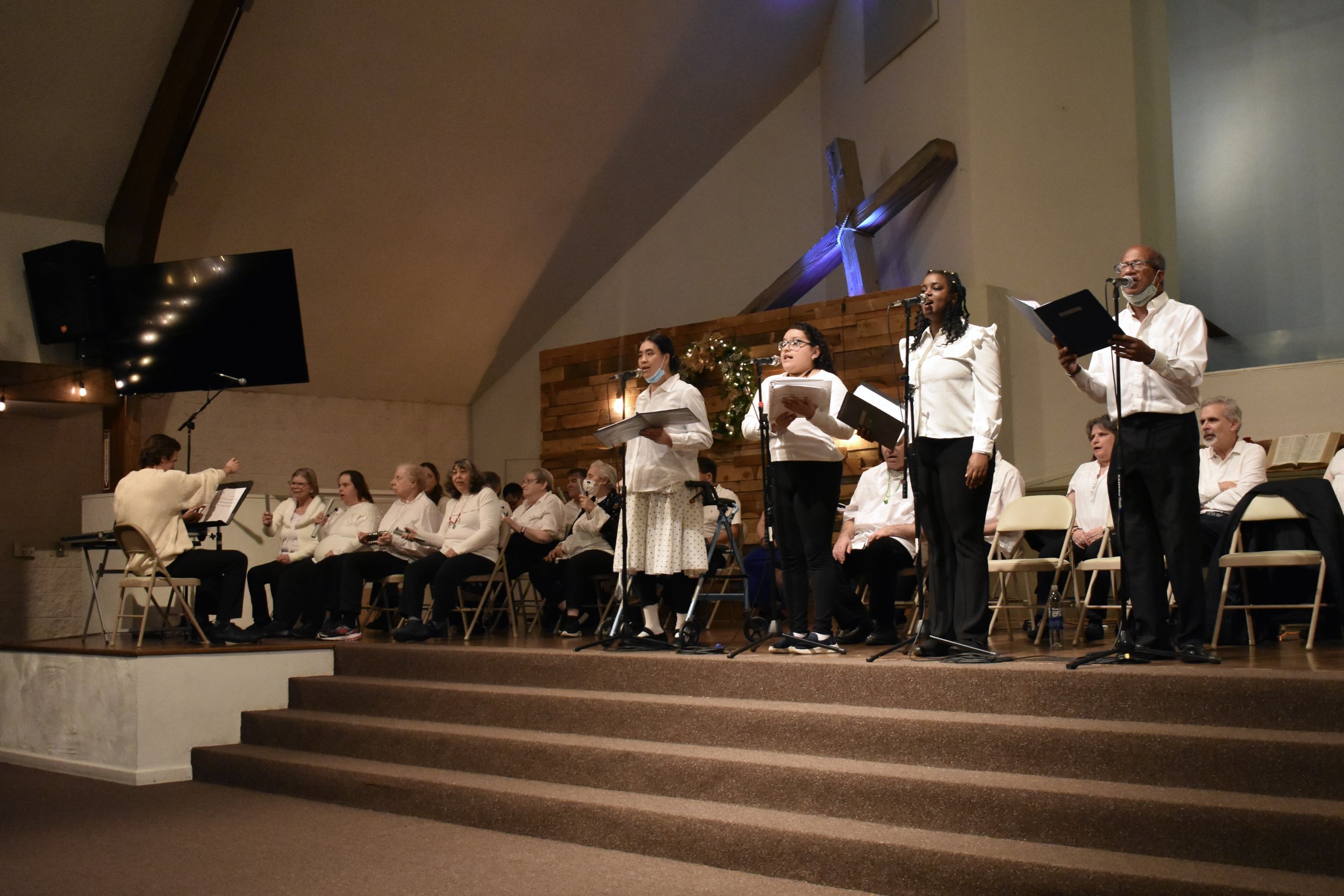  Creative Identity Anaheim participants singing, dancing, and playing instruments for their 27th Annual Winter Concert to an audience of attendees. 