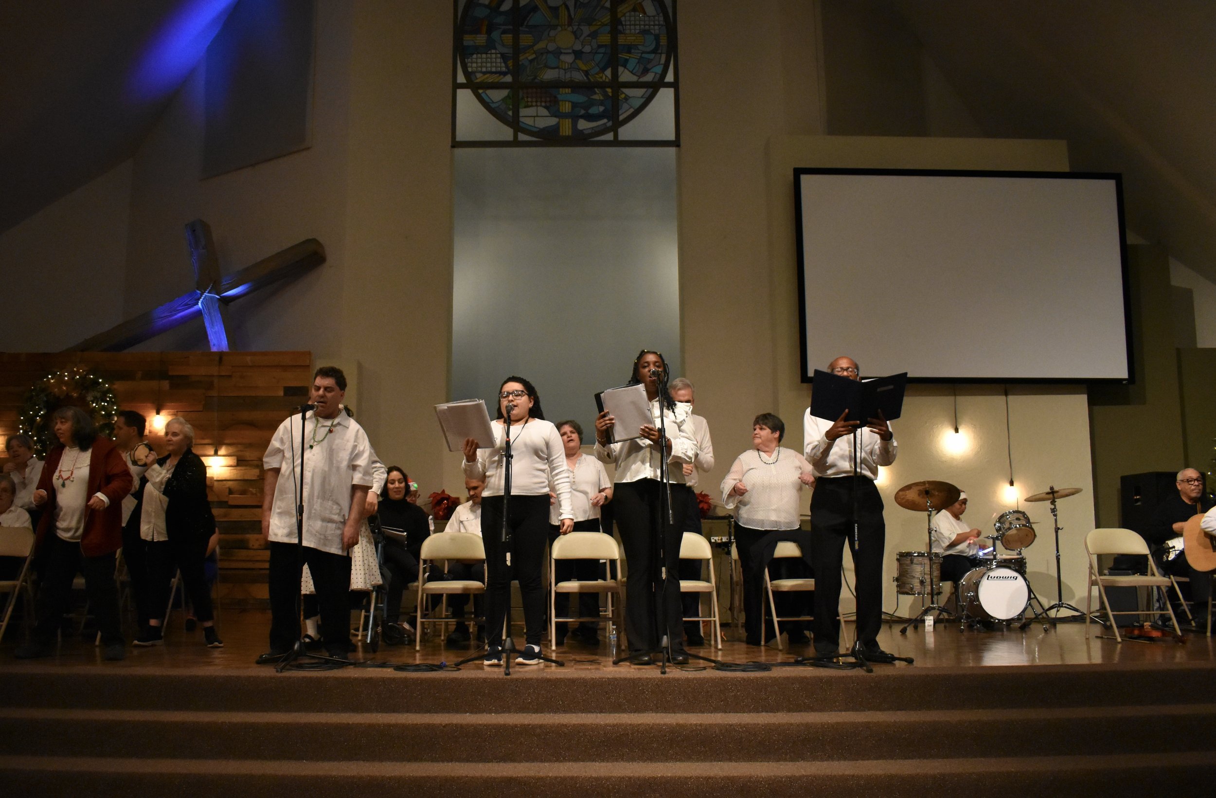  Creative Identity Anaheim participants singing, dancing, and playing instruments for their 27th Annual Winter Concert to an audience of attendees. 