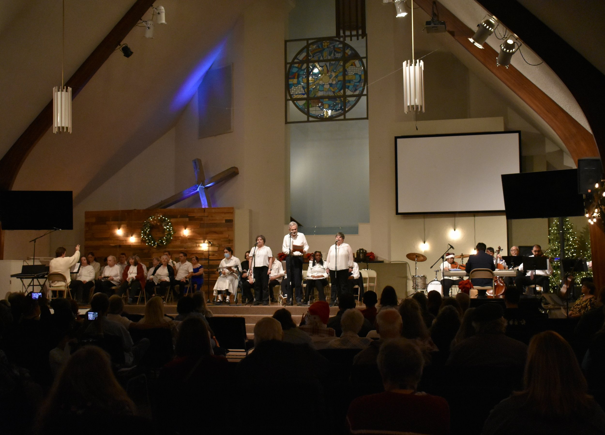  Creative Identity Anaheim participants singing, dancing, and playing instruments for their 27th Annual Winter Concert to an audience of attendees. 