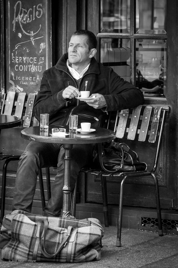 Enjoying a coffee at Île Saint-Louis in Paris.