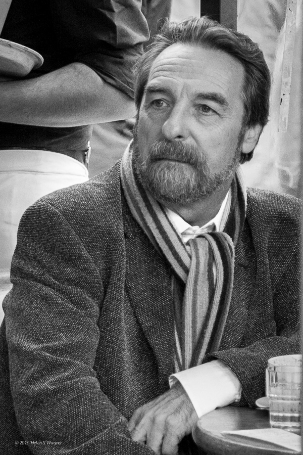 Although it wasn't early in a new year, this man at a café in Paris appears to be reflecting upon something, as well.