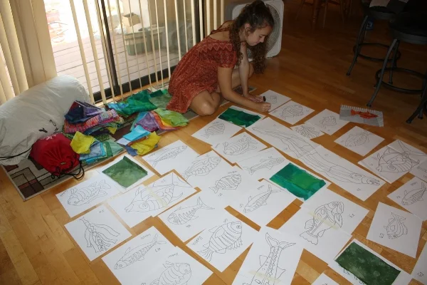 Lucy helping with the layout of the many fish patterns