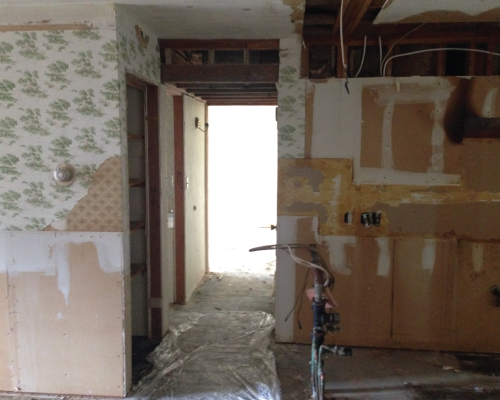 Next to the kitchen, you can see the drop ceiling that houses the existing HVAC. I eventually had the HVAC reworked to help bring the ceiling height there up a bit and to open up the hallway leading from the front door. 