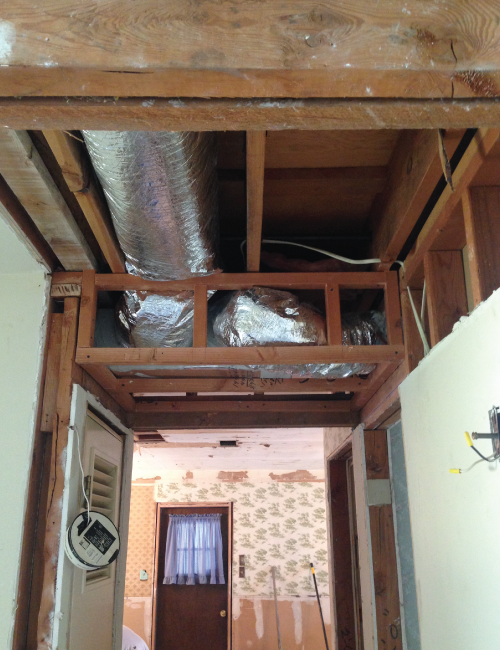 One section of the ductwork couldn't be recessed into the floor joists, but I was able to add in three additional inches to the ceiling height there. Every little bit helps!