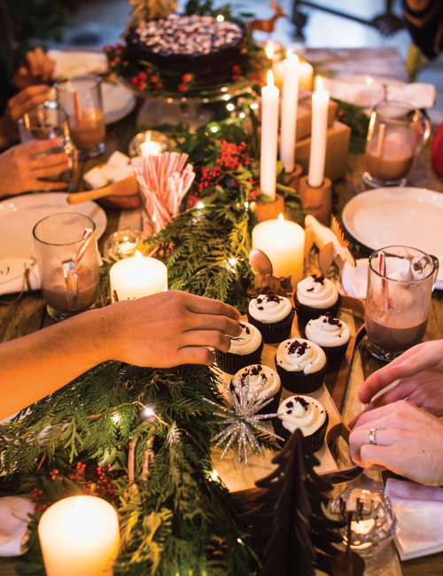 The fresh cedar garland wrapped in twinkle lights worked well as a natural table runner.