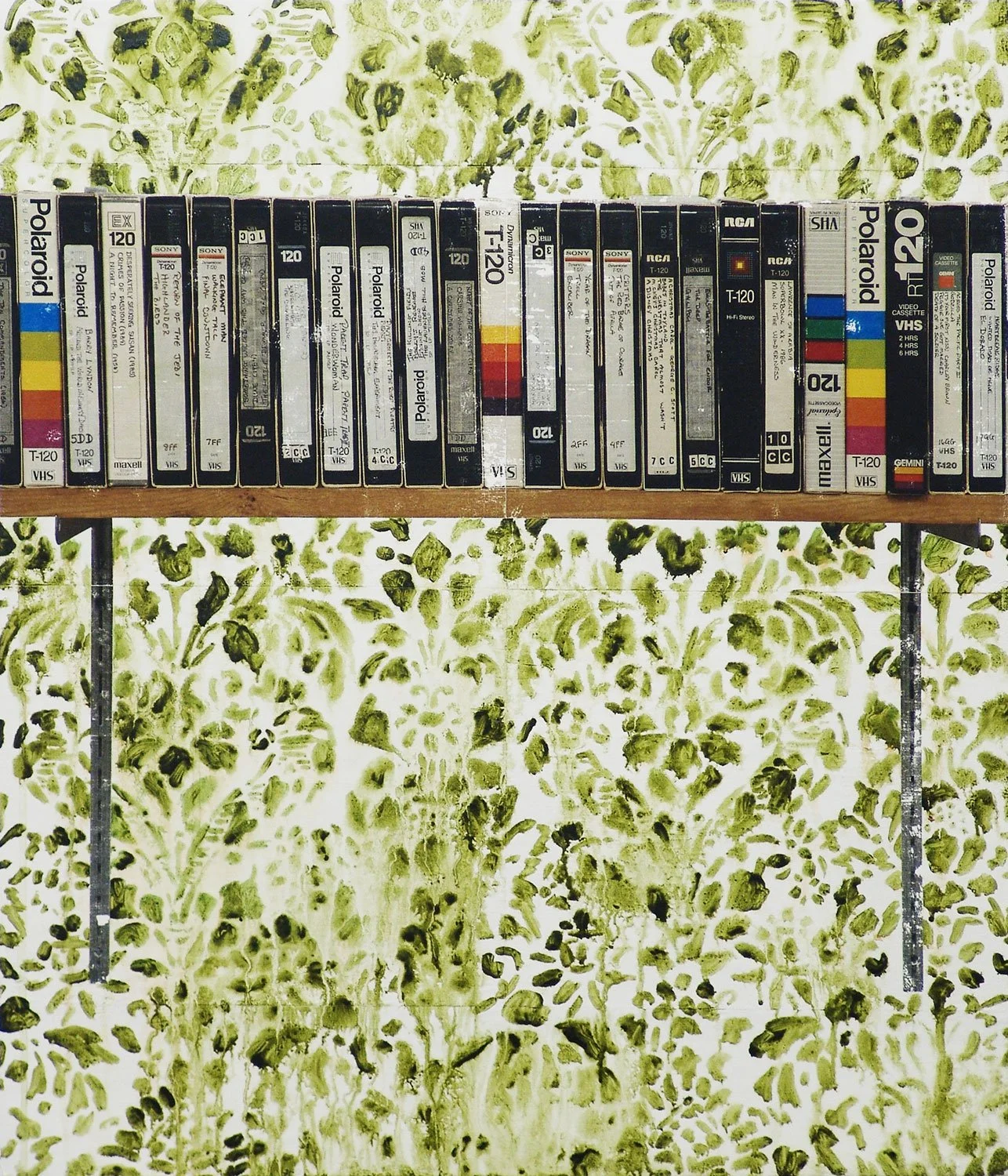 Painting of a row of VHS tapes with handwritten labels and colorful packaging on a shelf against distressed green floral wallpaper.