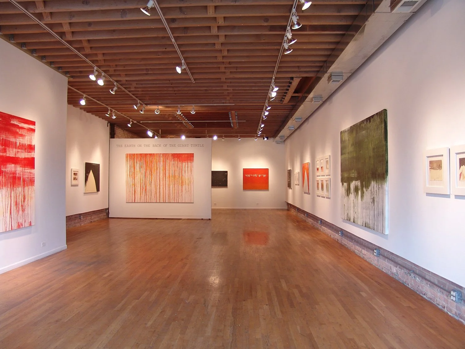 Gallery installation view of a Hollis Brown Thornton exhibition, showing paintings and works on paper displayed throughout a wood-floored gallery space.