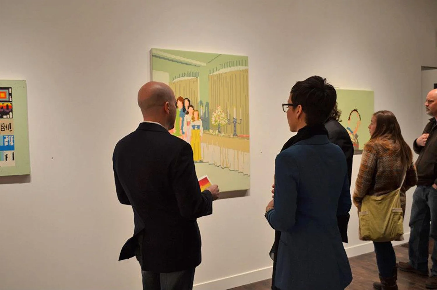 Visitors viewing Hollis Brown Thornton paintings during an exhibition, including a large interior scene with figures and architectural details.