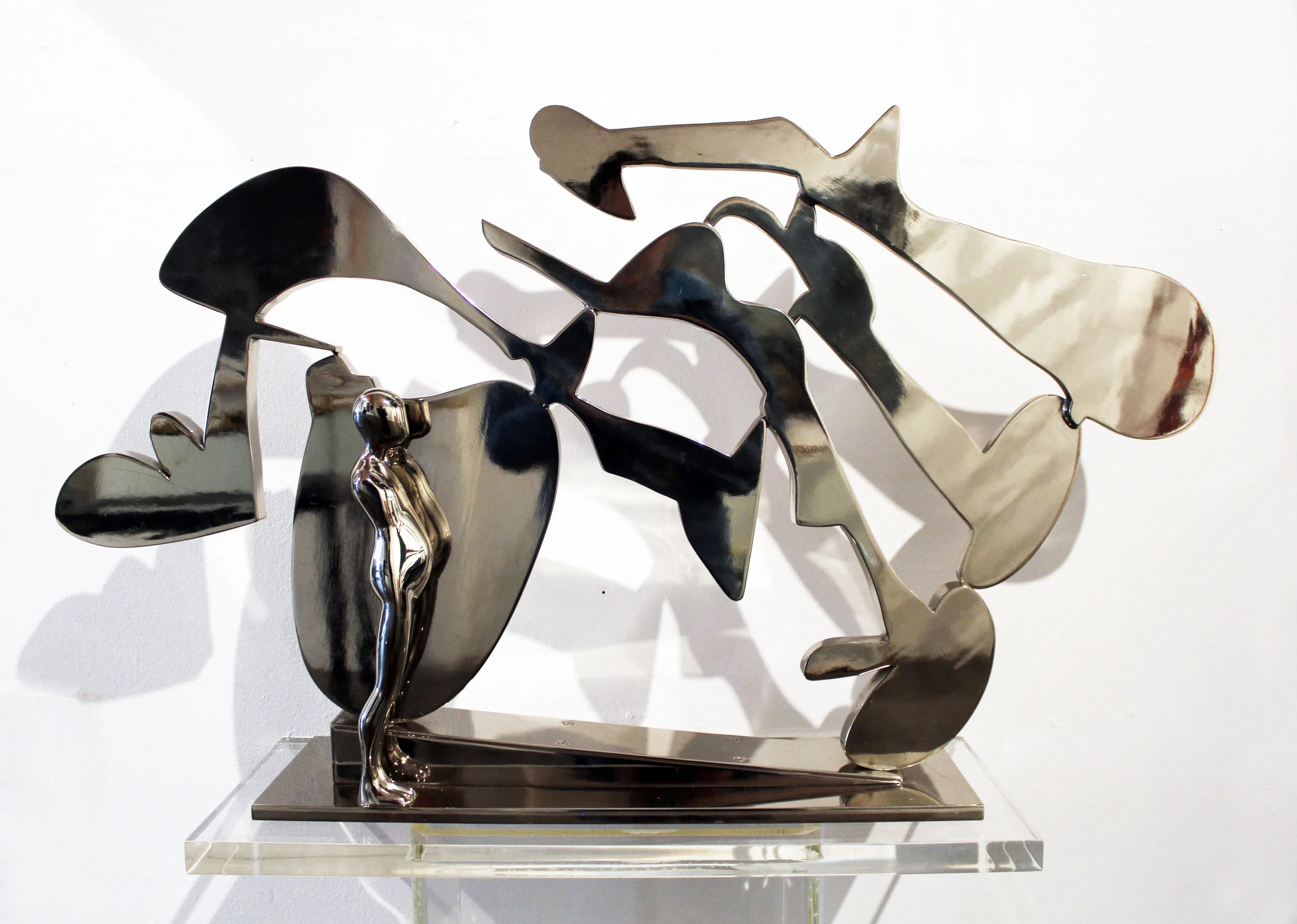 Ernest Trova FM/Etc. #10 , 1978 Unique bronze figure with steel landscape and high-polished nickel plating Stamped signature with date on base Sculpture: 20.5 x 35 x 7 inches; Pedestal: 36 x 24 x 10 inches Provenance: PACE Gallery, New York, NY, tag on base Estimate: $6,000/$8,000