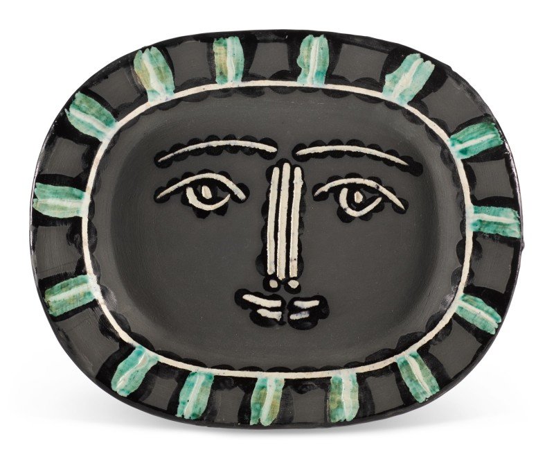  Pablo Picasso  (1881-1973)  Visage Gris, 1953  Terre de&nbsp;faïence dish, partially glazed and painted  From the edition of 500  Inscribed ‘Edition Picasso, with the d’Apres Picasso Madoura stamps  Provenance:  The Estate of Molly Teitelbaum  12.5 
