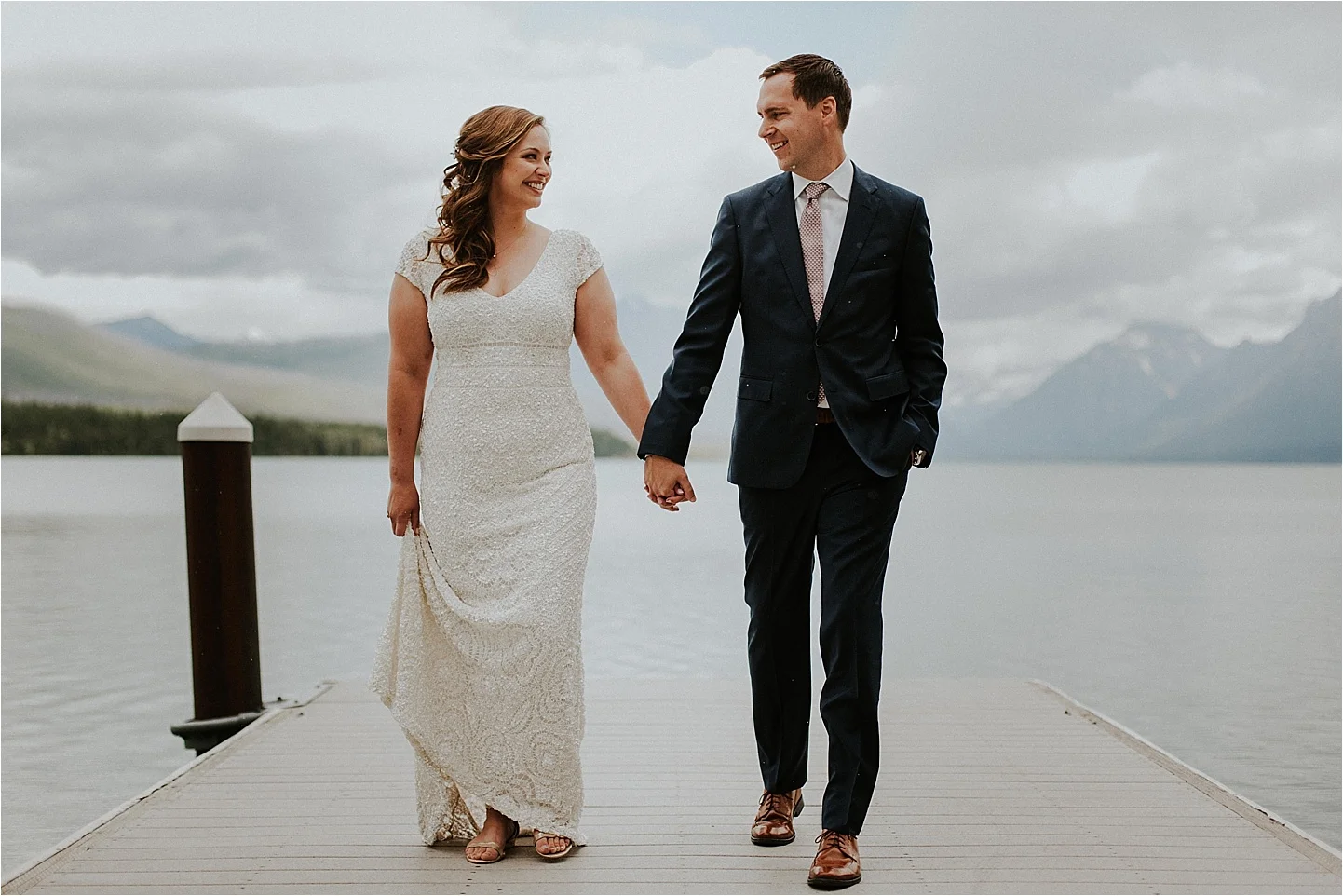 glacier national park walking bride and groom.jpg